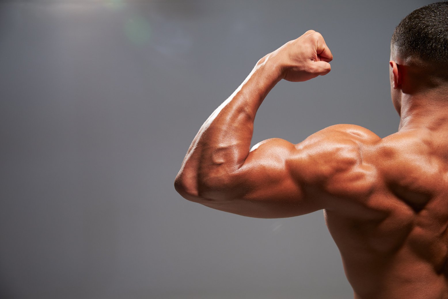 Male Bodybuilder Flexing Bicep